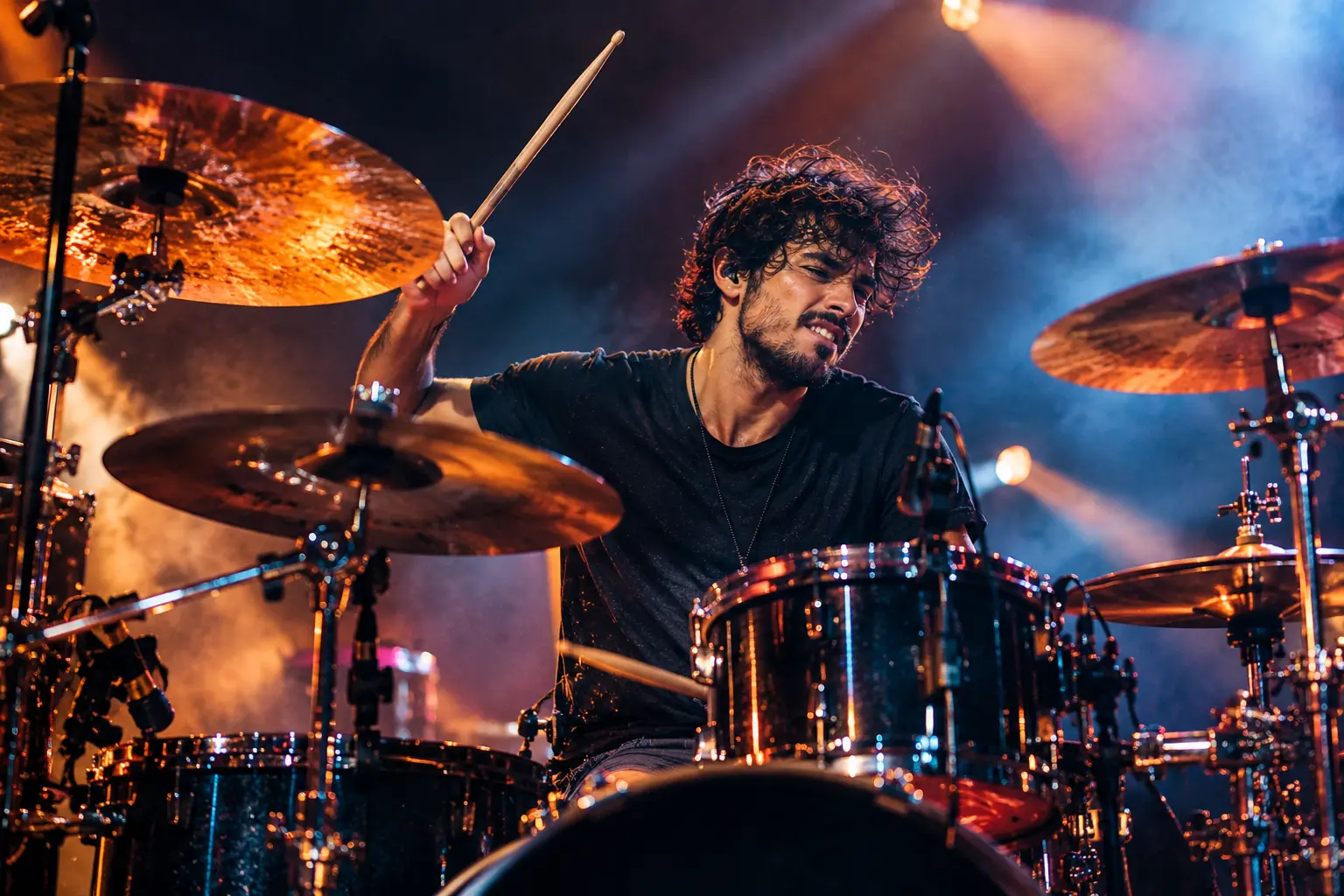 Drummer performing on an acoustic drum kit during a live show